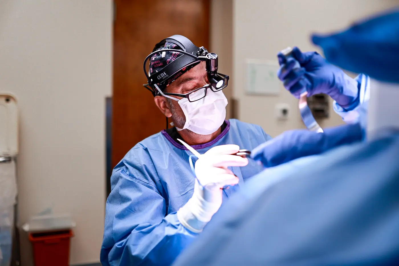 Dr. Brett Carlin operating in the Carlin Plastic Surgery on-site surgery center