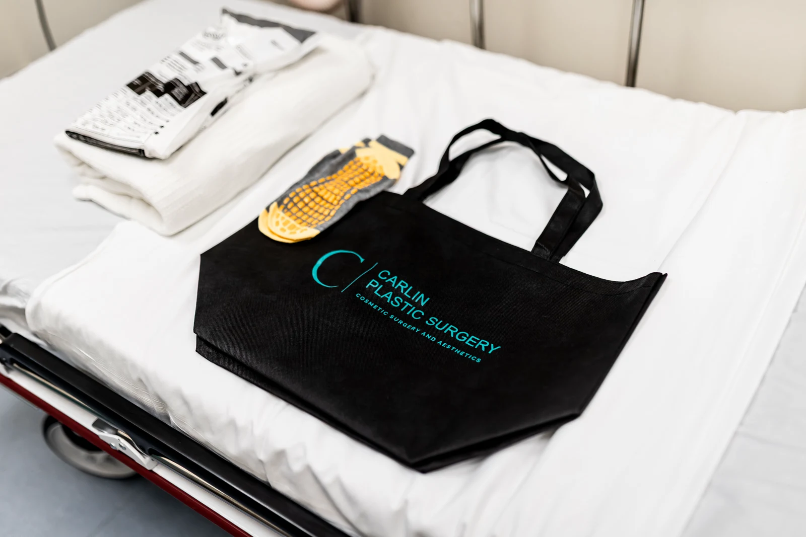 A stretcher in a pre-operative and recovery bay at Carlin Plastic Surgery